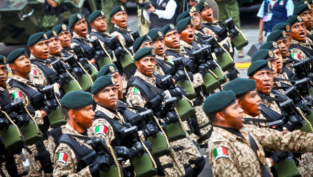 Dozens of Green Berets march during the Independence Day military parade on the Zocalo square in Mexico City Mexico City, Mexico, September 16 -- A view of a military contingent during the parade of the Mexican armed forces in the Zocalo (Central Square) and some main streets of the historic center of Mexico City on the occasion of the Independence Day solemnly celebrated across the country. tank musician stock pictures, royalty-free photos & images