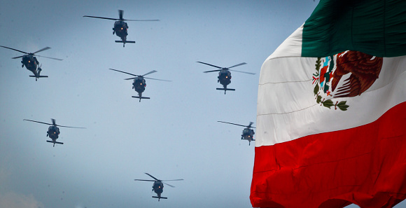 Mexico City, Mexico, September 16 -- A flock of military helicopters during the parade of the Mexican armed forces in the Zocalo (Central Square) in the historic center of Mexico City on the occasion of the Independence Day solemnly celebrated across the country.