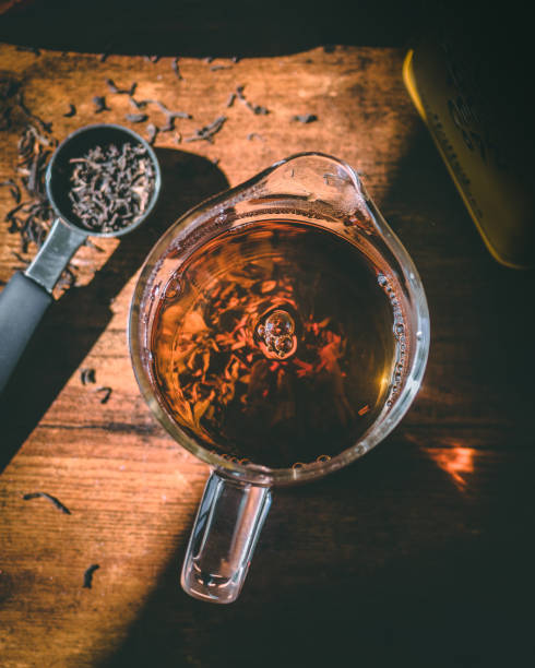 istock Overhead view of loose leaf dried tea being brewed. 1220799642