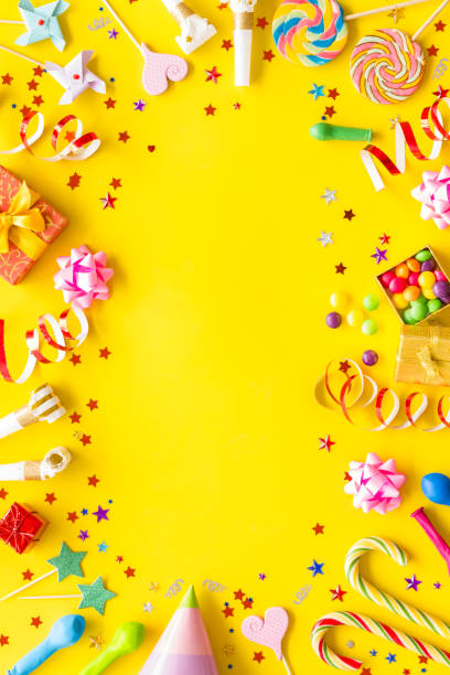 Decoration for party frame on yellow background top view mockup stock photo