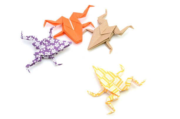 istock Colorful paper frogs 1220801458