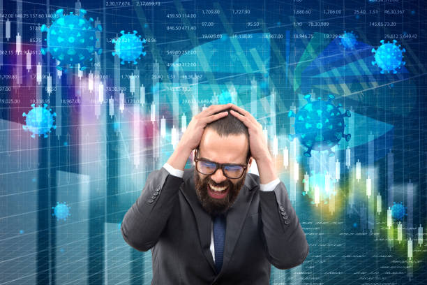 istock Businessman with head in hands during global financial crisis 1220802480