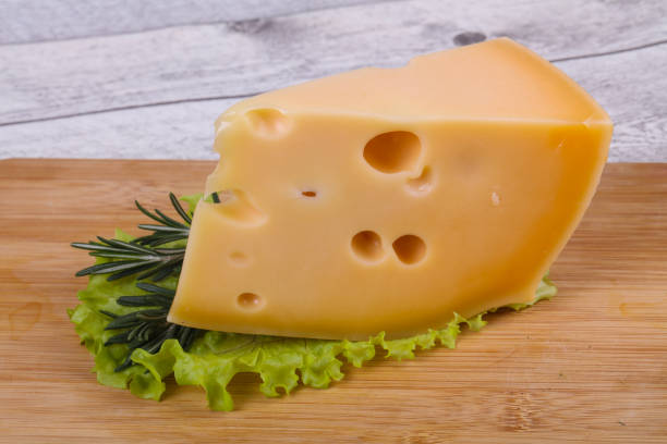 istock Maasdam cheese  in the board served salad leaves 1220802673
