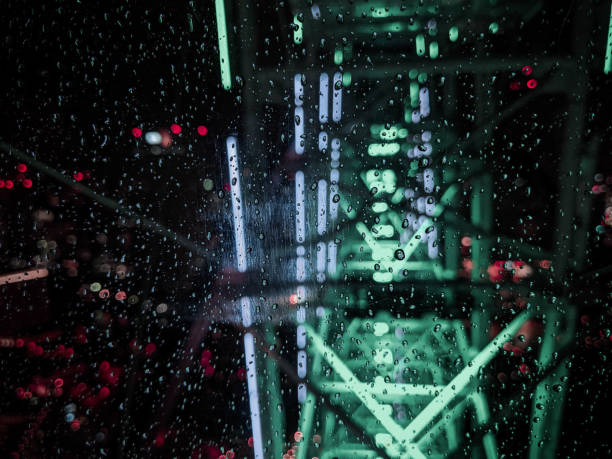 istock Rain Drops on a Glass with a Neon Light Background 1220804173