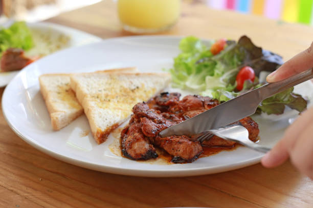 Pork steak and toast with knife, focus selective