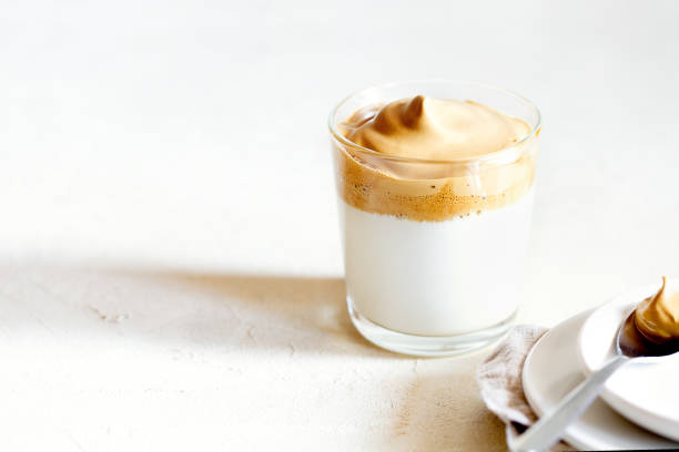 istock Trendy fluffy creamy whipped iced Dalgona coffee on white background 1220805841