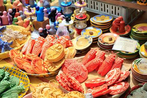 Nice, France - May 11, 2014: Ceramics exposed for sale on Cours Saleya, most famous City market, offers various gifts, flowers also antiques and other products. Cours Saleya Market in Nice is located on the French Riviera in the Provence-Alpes-Cote d'Azur region