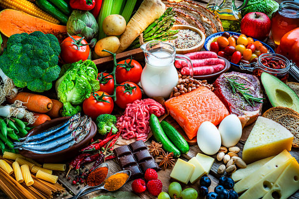 food backgrounds: table filled with large variety of food - healthy eating food rice high angle view imagens e fotografias de stock