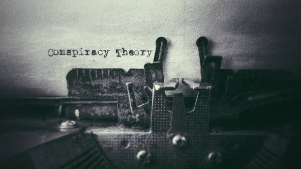 Social issue Conspiracy Theory text typed on paper with old typewriter stock photo conspiracy stock pictures, royalty-free photos & images
