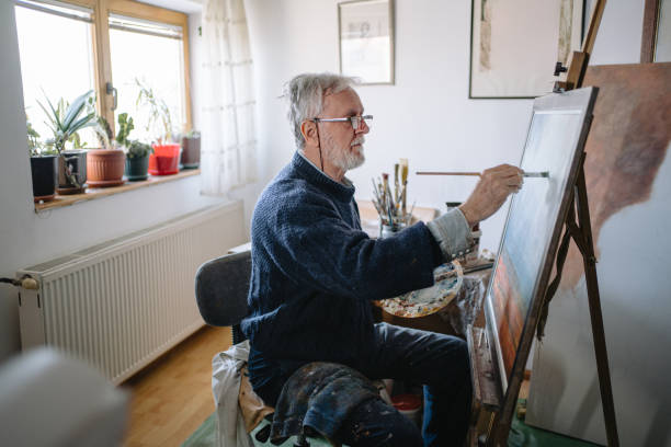 istock Creative artist painting a picture in his creative space 1220810780