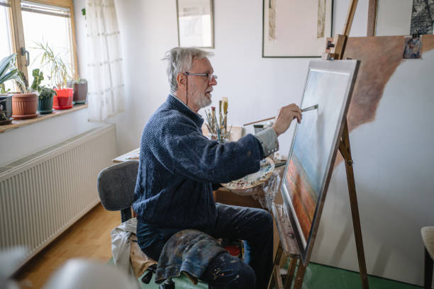istock Skilled artist painting a field from his memory 1220810788