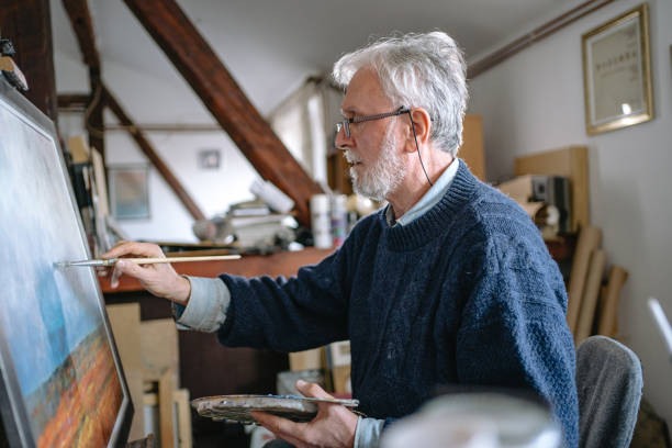 istock Senior man enjoying his hobby during virus lock-down 1220810819