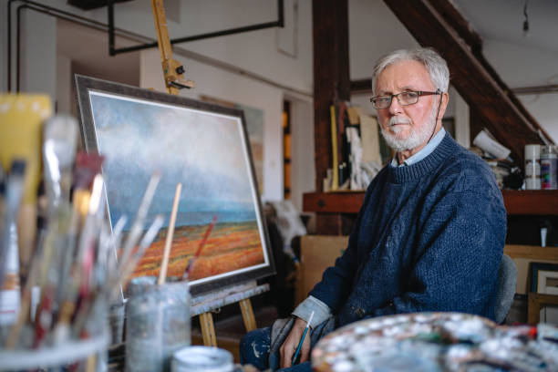 istock Lonely artist sitting in his home art studio 1220810833