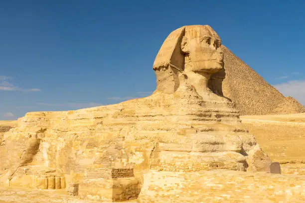 The Great Sphinx of Giza portrait with the pyramids on background, symbol of Egypt