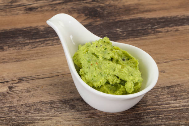 istock Avocado guacamole sauce with chili pepper 1220811792
