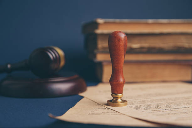 istock Notary's public pen and stamp on testament and last will. Notary public 1220813506