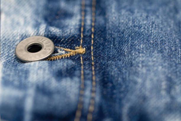 istock Close-up shot of denim jacket, denim stitch, denim jacket button, denim jacket's buttonhole 1220815072