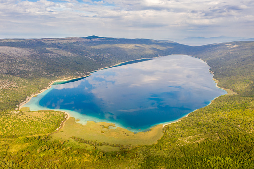 View of an idyllic scene with Thea Aerial view of a landscape with a lake,  Cres Island,  Croatia