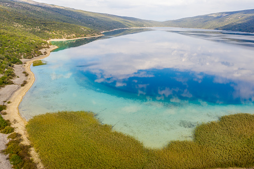 View of an idyllic scene with Thea Aerial view of a landscape with a lake,  Cres Island,  Croatia