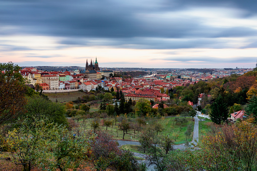 Prague autumn landscape. Prague autumn landscape view to Saint Vitus cathedral. Prague. Prague panorama. Prague, Czech Republic. Scenic autumn aerial view of the Old Town with red foliage. Czechia.