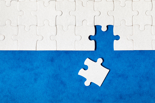 French national flag printed on a jigsaw puzzle with lots of texture, representing a government or political problem to be solved.