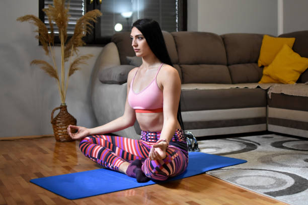 istock Young sporty woman practicing yoga 1220818852