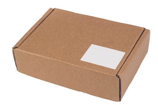 Brown cardboard box closed with a sticker label. Isolate on a white background. Delivery, packaging concept