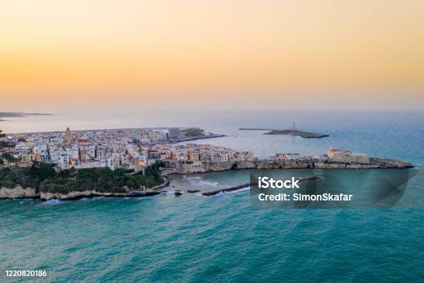 Aerial View Of Coastal Old Town At Sunset Vieste Puglia Italy Stock Photo - Download Image Now