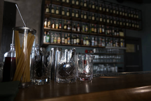 istock Cafe with half-lighted bar counter full of luxury alcohol 1220820373