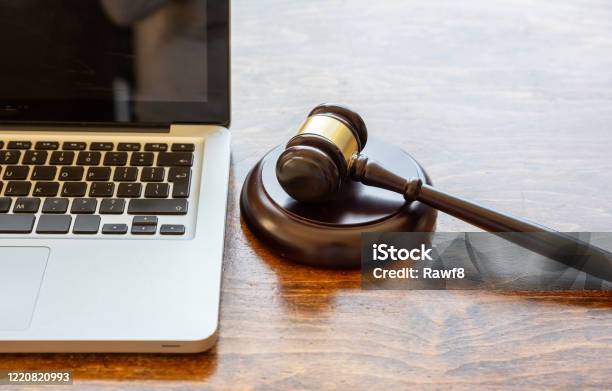 Judge Gavel And A Laptop Wooden Background Online Auction Concept Stock Photo - Download Image Now