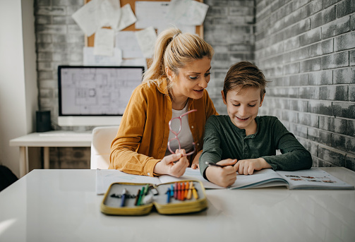 Mom and son working during lockdown