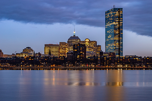 Blue hour cityscape buildings reflecting in water. in Boston, MA, United States