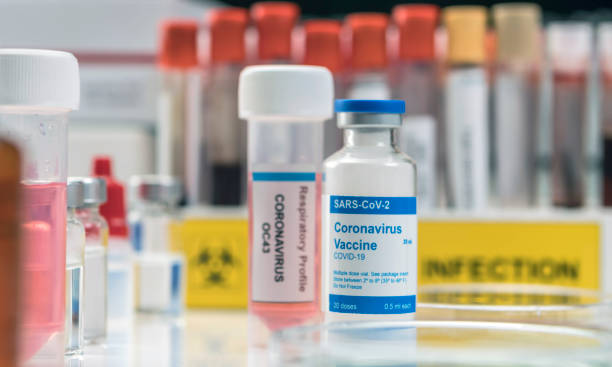 istock Coronavirus covid-19 experimental vaccine in a laboratory, conceptual image 1220823387