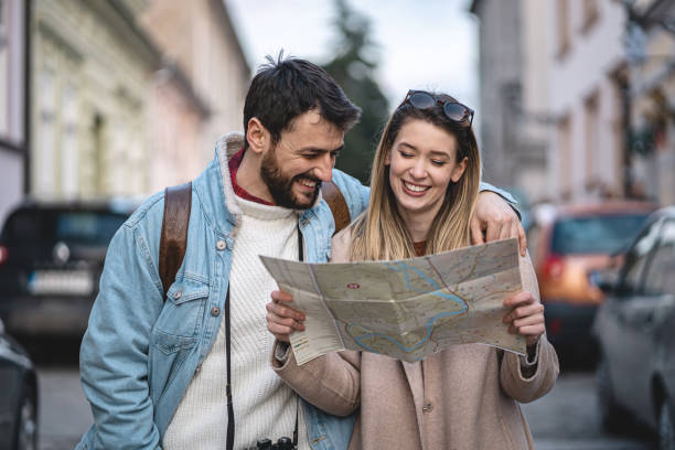 istock Tourists sightseeing the city with a map 1220823545