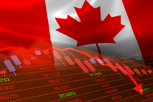 Bandera canadiense y desaceleración económica con indicadores del mercado bursátil en rojo photo