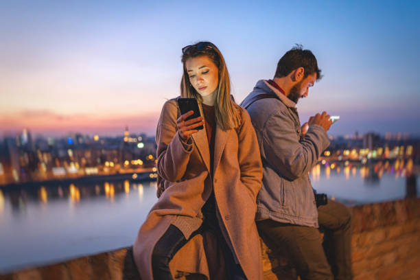 istock Bored couple occupied with social media 1220825536