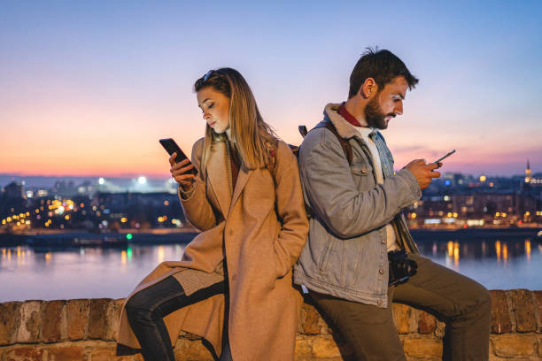 istock Bored couple occupied with social media 1220825727