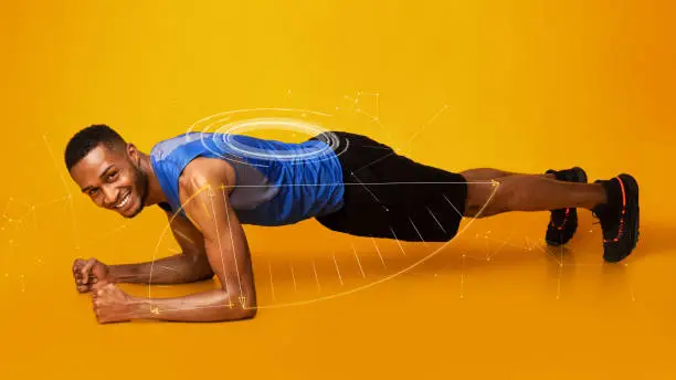 Strong African American man doing plank exercise on orange background, collage. Panorama