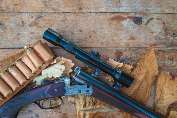 istock Beautiful hunting rifle with optical sight, hunting belt 1220826051