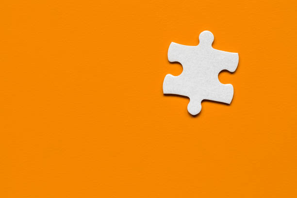 Closeup of jigsaw puzzle isolated. Missing jigsaw puzzle piece, business concept for completing the puzzle piece. Group of puzzle and a puzzle piece. Teamwork concept. Think difference concept.