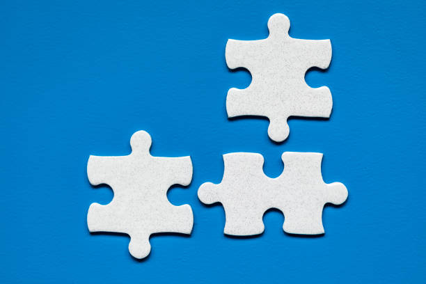 istock White jigsaw puzzle. White puzzle pieces on color background. Unfinished white jigsaw puzzle pieces on color background. 1220826127