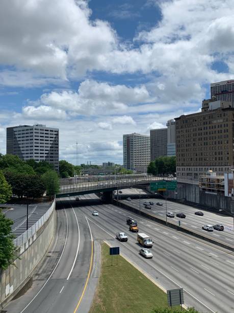 Downtown Atlanta with a blue sky and light highway traffic