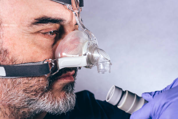 istock Man with respiratory mask for assisted breathing 1220826944