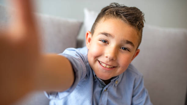 istock Happy child making selfie for social networks. 1220827148