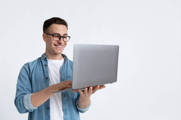 istock Great job concept. Guy holds laptop in hands 1220827519