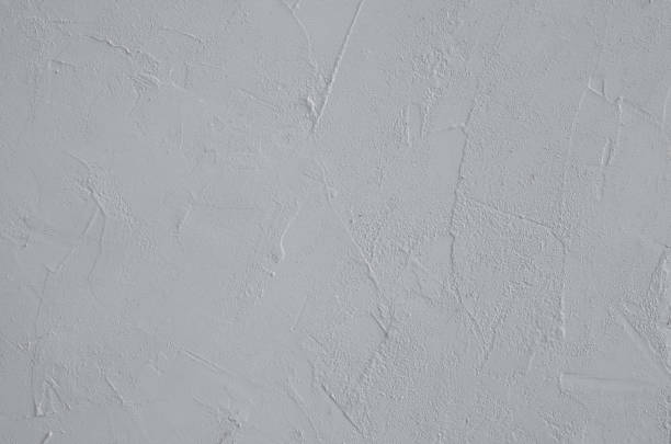 istock A close-up of the surface is gtey with plaster texture. 1220827813