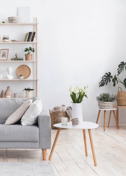 istock Modern Living Room Interior With Comfortable Sofa, Coffee Table And Plants 1220828993