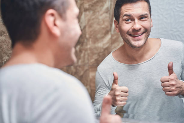istock Pleased Caucasian male standing in a bathroom 1220830447