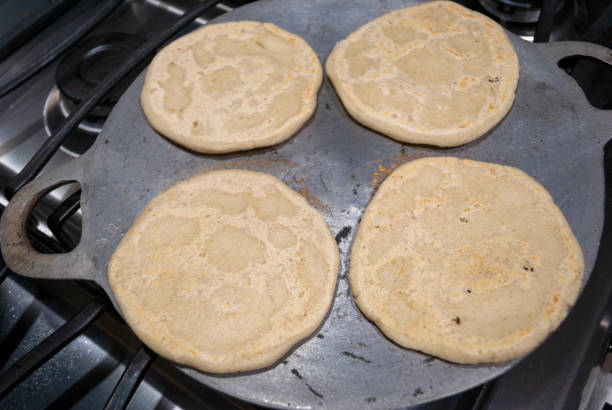 istock Nutritious handmade corn tortilla cooked on a metal griddle on a gas stove in a Guatemalan home. 1220830665