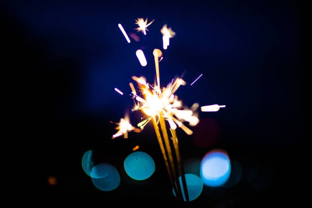 istock Sparks in the dark. Sparks. Christmas and New Year time. Magic light 1220832763